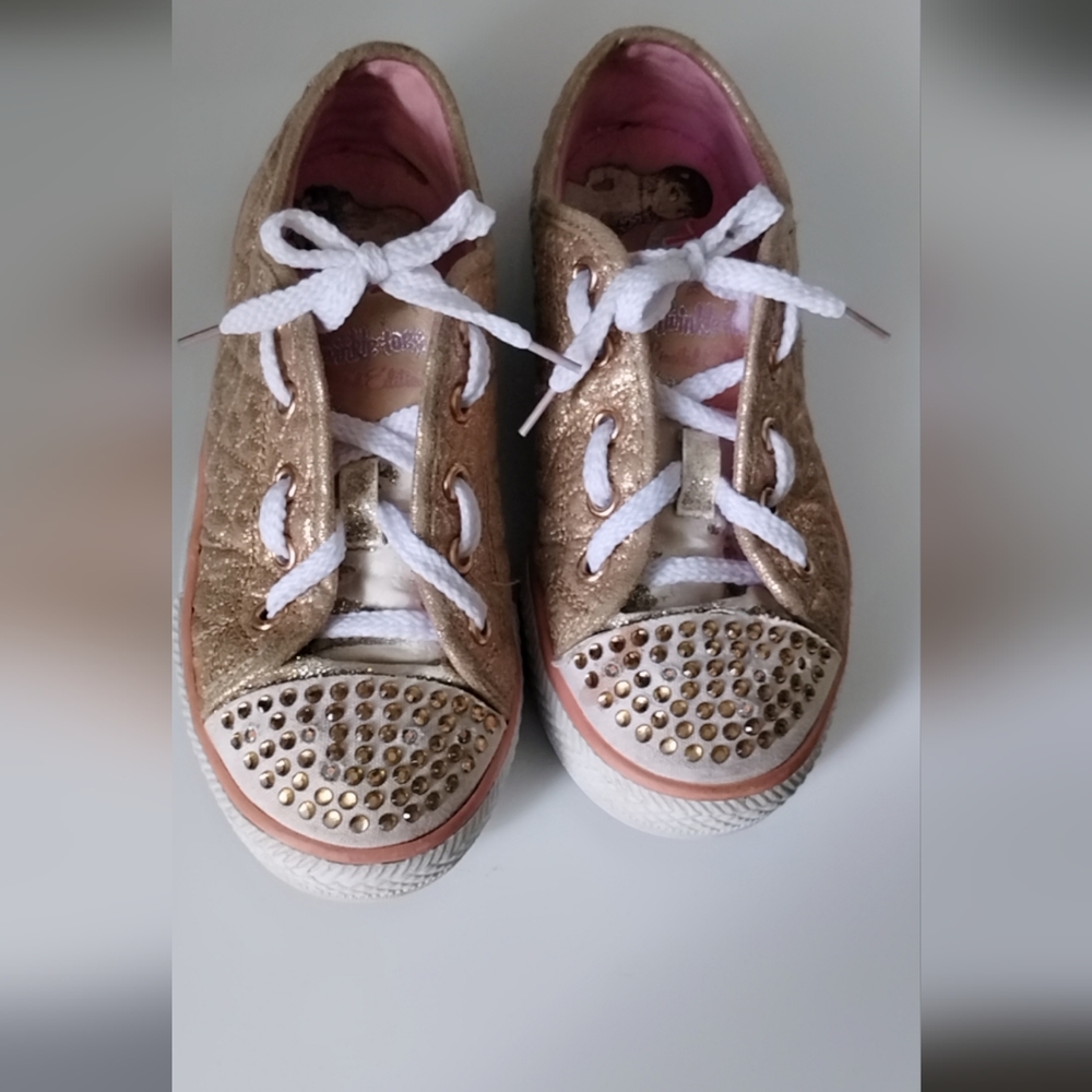 Twinkle toes Shoes. It's still good and still lights up.